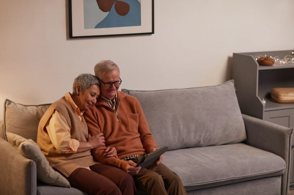Elderly couple sitting on a couch in an attorney's office considering elder law options at Turke & Steil LLP in Madison, WI